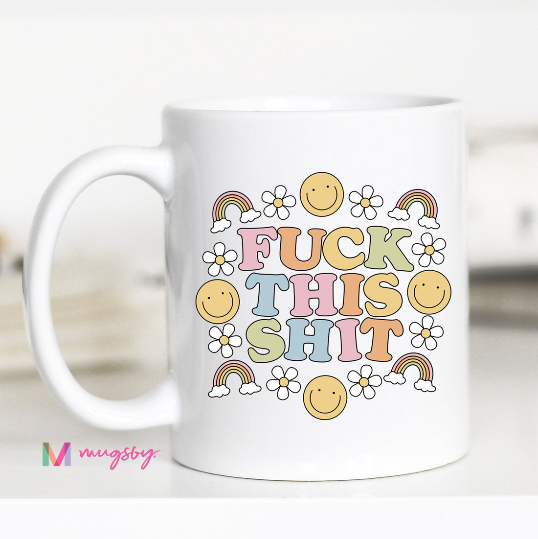 White mug with colorful text and graphics on a white background
