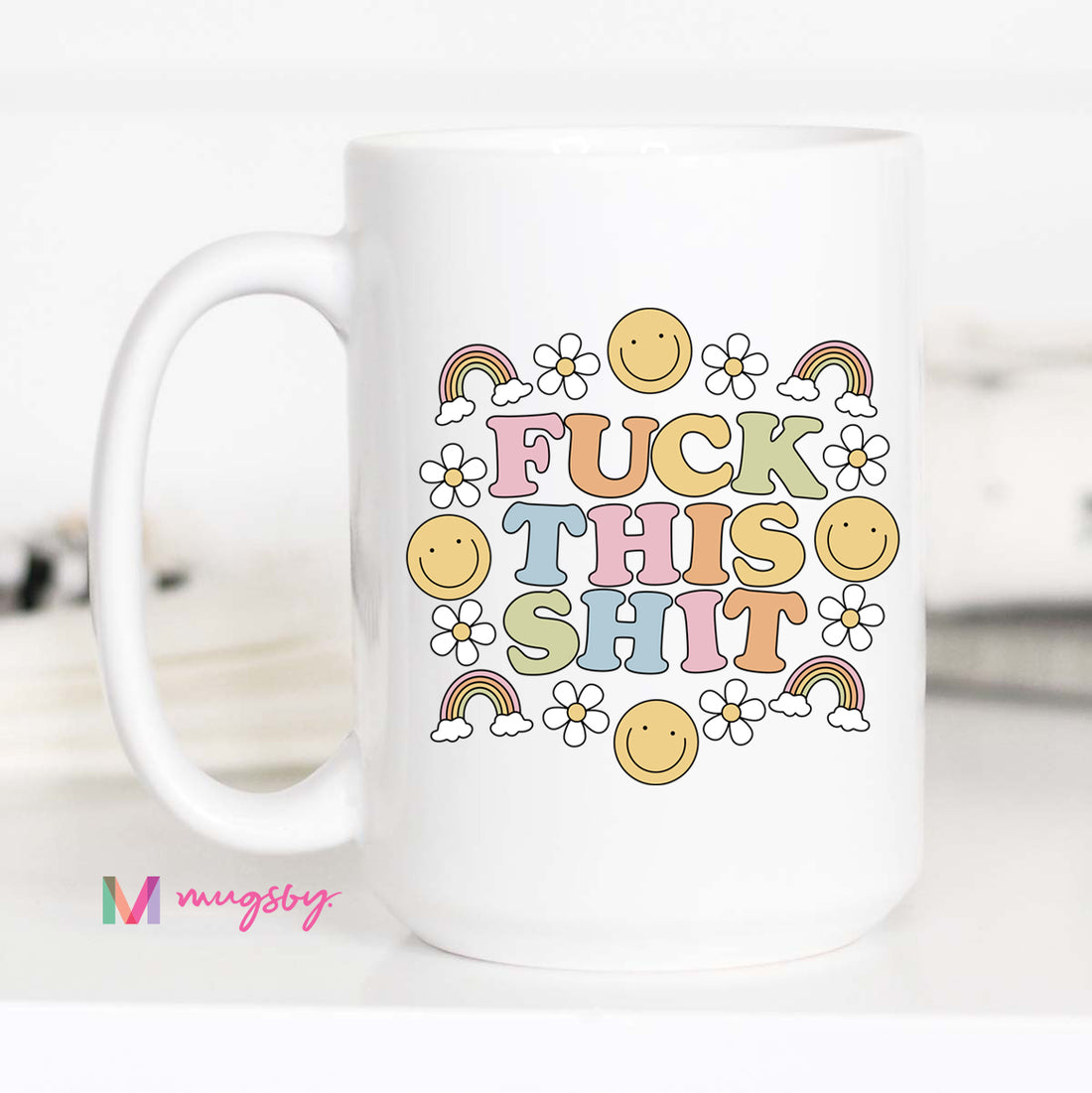 White mug with colorful text and graphics on a white background